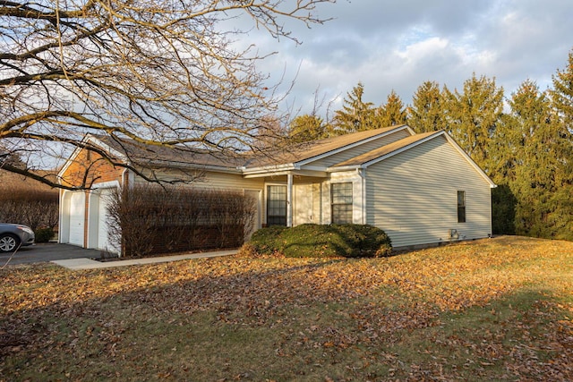 ranch-style home featuring a garage