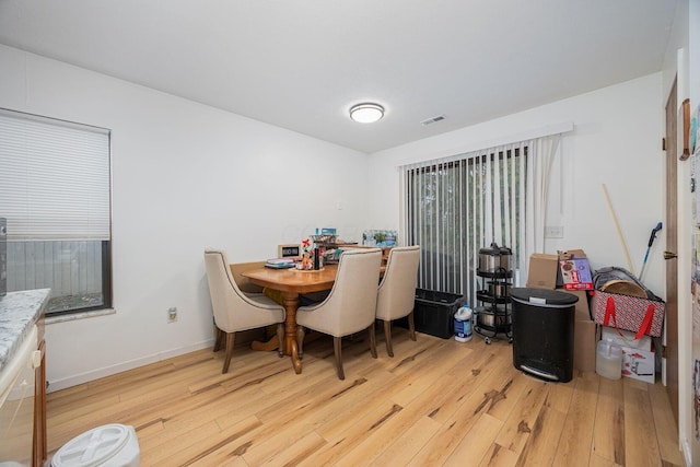 dining area with light wood-type flooring