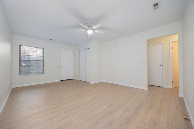 unfurnished room featuring light hardwood / wood-style flooring and ceiling fan