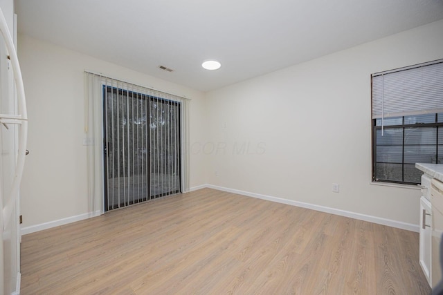 empty room with light wood-type flooring