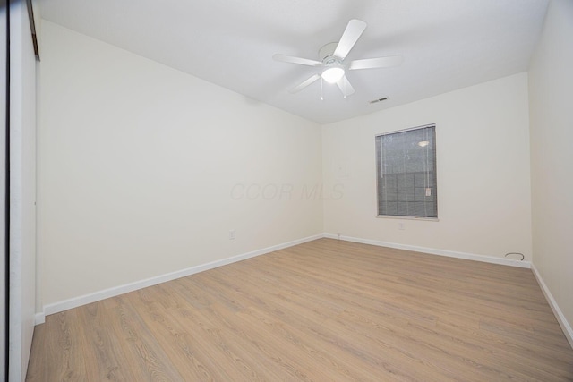 spare room featuring ceiling fan and light wood-type flooring