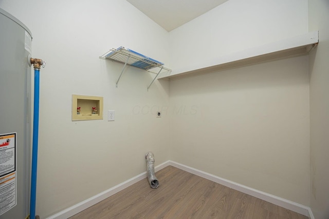 washroom with washer hookup, hookup for an electric dryer, water heater, and wood-type flooring