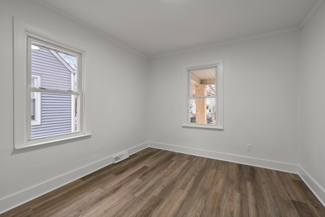 unfurnished room with dark hardwood / wood-style flooring and ornamental molding