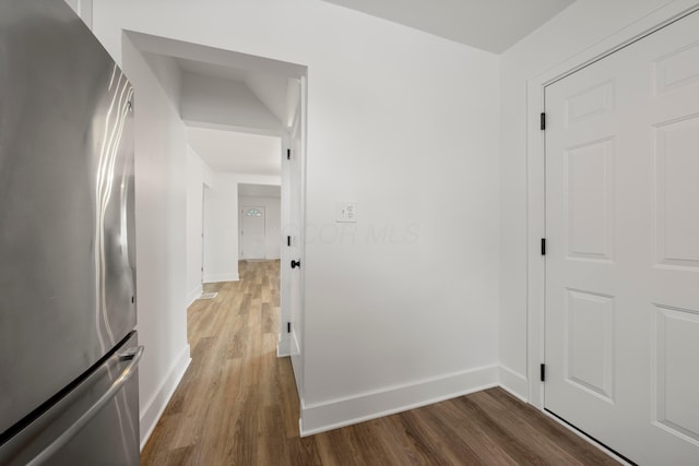 hall with hardwood / wood-style flooring