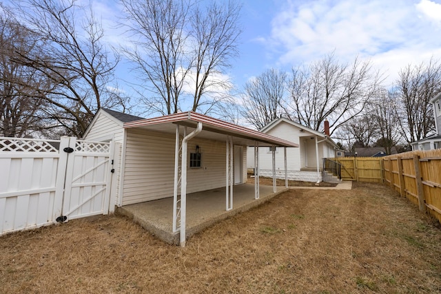 rear view of house with a patio area and a lawn