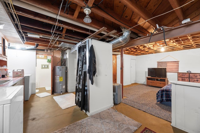 basement with independent washer and dryer and water heater