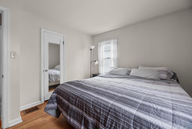 bedroom with wood-type flooring