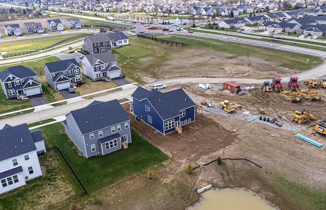 birds eye view of property with a residential view