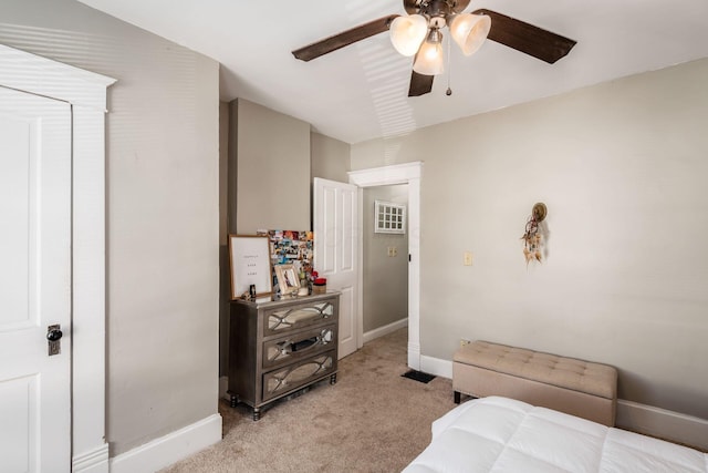 bedroom featuring light colored carpet and ceiling fan