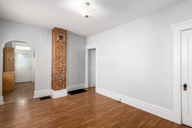 empty room with hardwood / wood-style floors