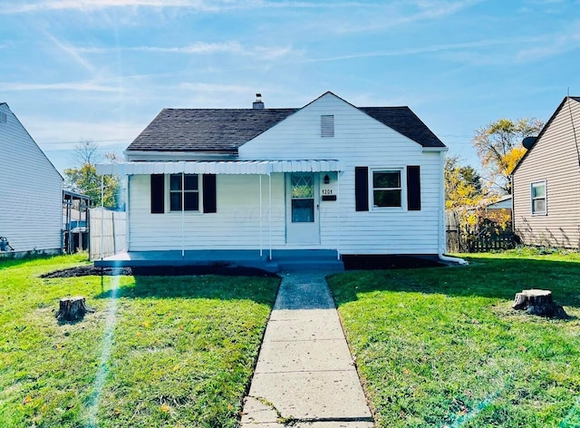 bungalow featuring a front yard