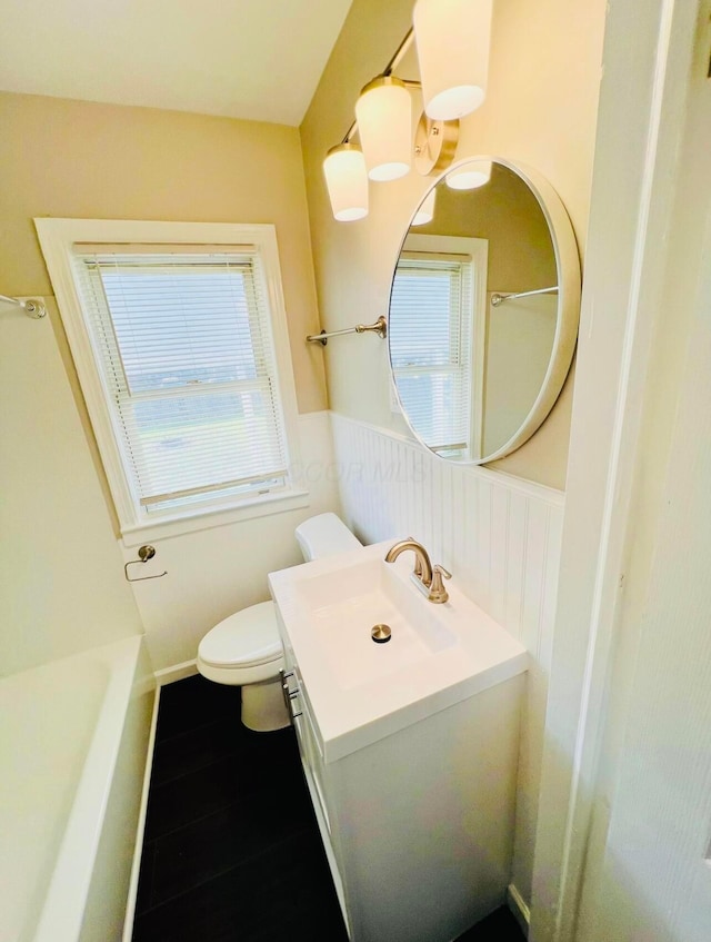 bathroom featuring vanity and toilet