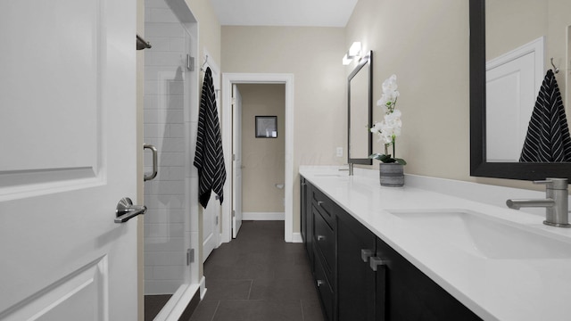 bathroom featuring vanity, tile patterned flooring, and a shower with shower door