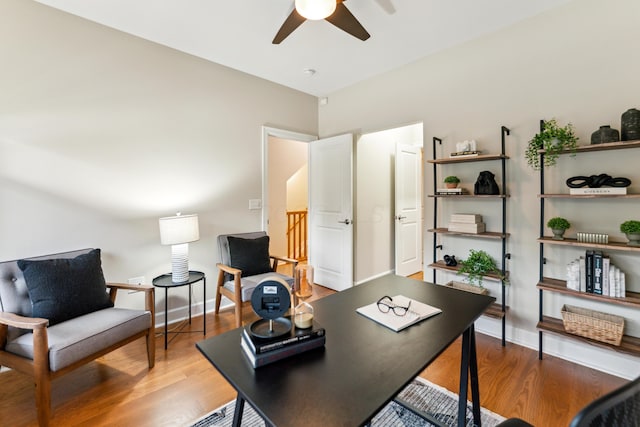 home office with baseboards, wood finished floors, and ceiling fan