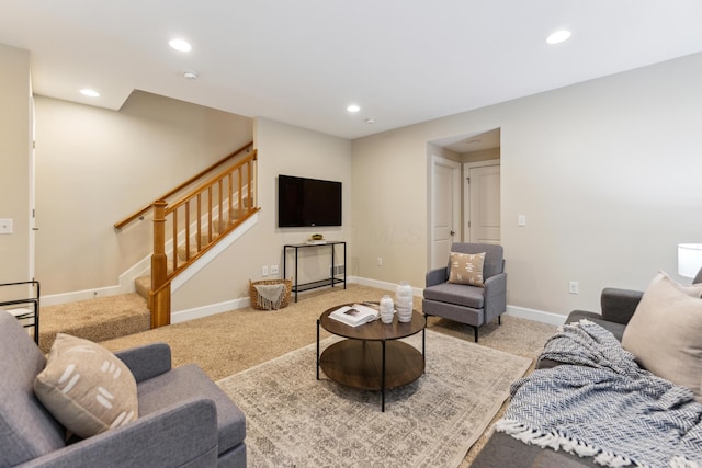 living area featuring recessed lighting, stairway, and carpet floors