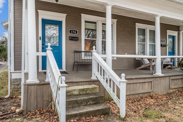 view of exterior entry with covered porch