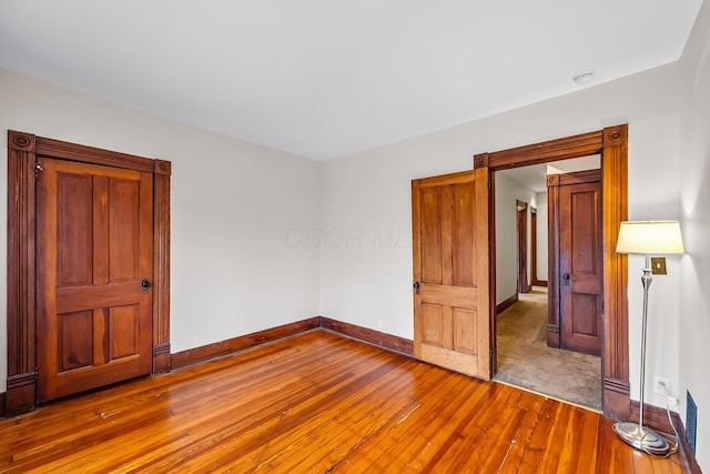 unfurnished bedroom featuring wood-type flooring