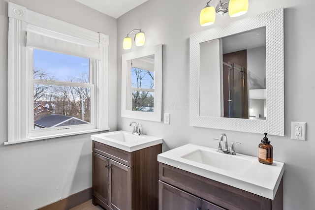 bathroom with walk in shower and vanity