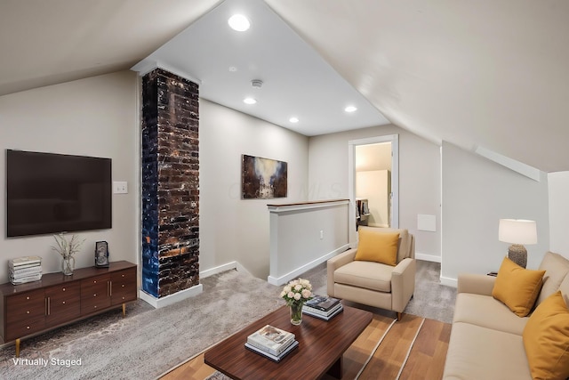 living room with lofted ceiling and light hardwood / wood-style flooring