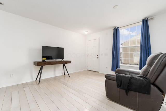 sitting room with light hardwood / wood-style floors