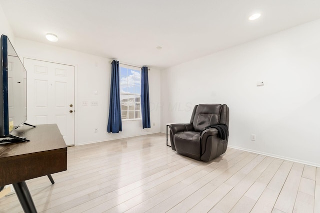 sitting room with light wood-type flooring