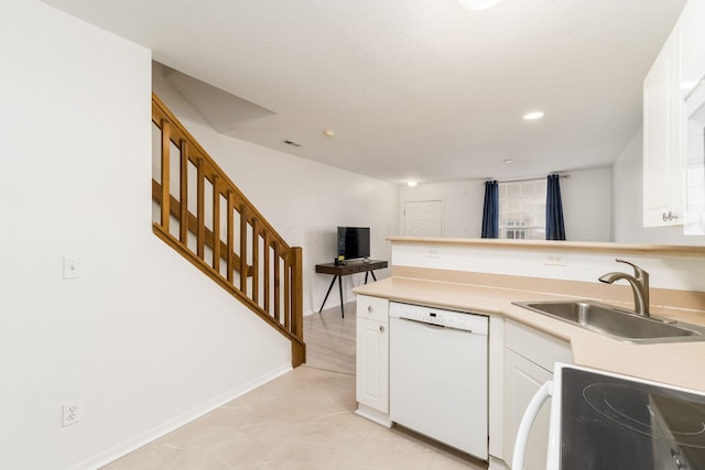 kitchen with white cabinetry, sink, electric range oven, and white dishwasher