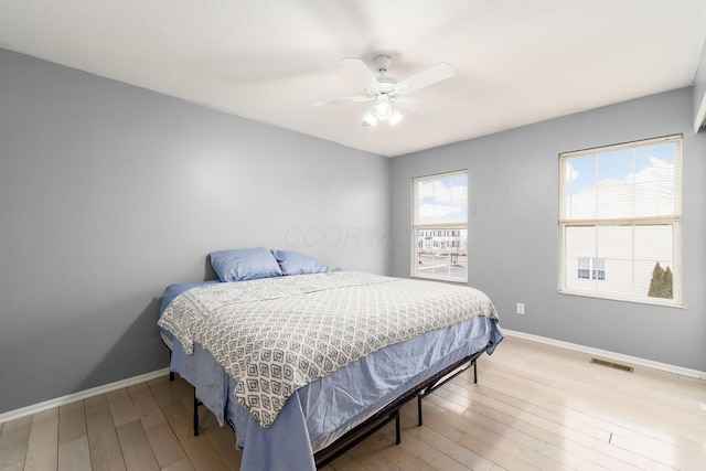 bedroom featuring light hardwood / wood-style flooring and ceiling fan