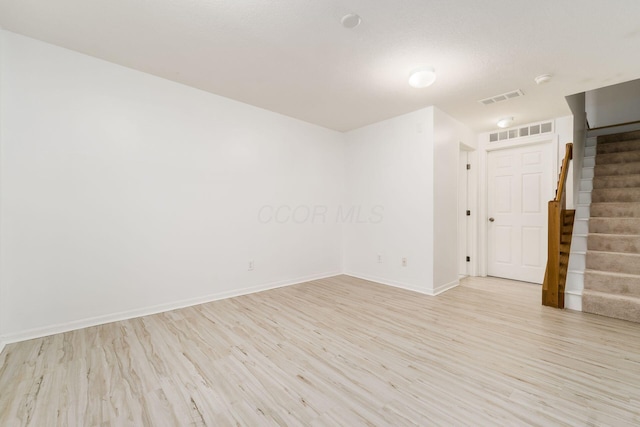 spare room with light hardwood / wood-style floors