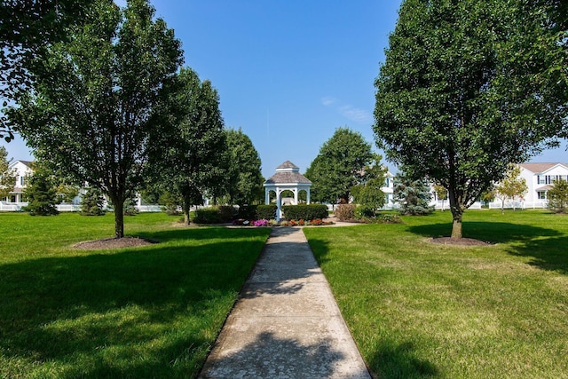 view of property's community featuring a gazebo and a lawn