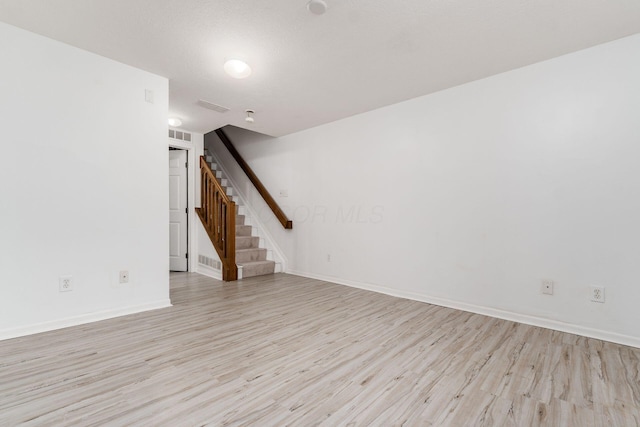 7083 Gallant Fox Dr Unit 4, New Albany, OH 43054 - spare room featuring light wood-style floors, stairway, and baseboards