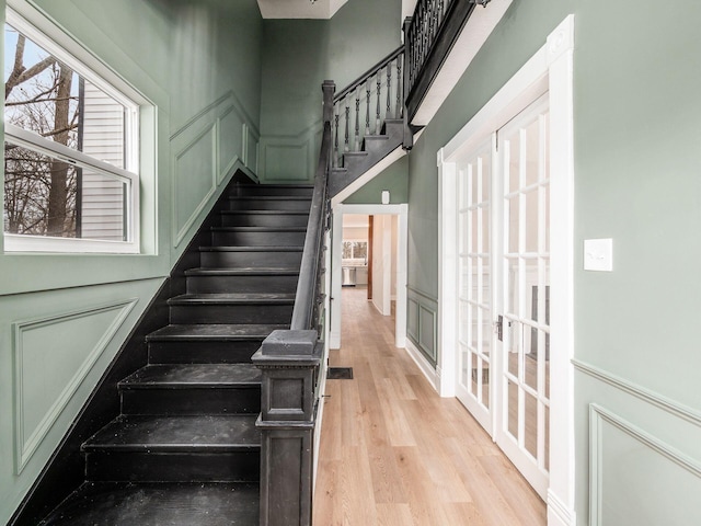 stairs featuring hardwood / wood-style floors