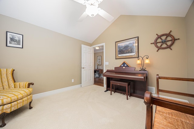 living area featuring baseboards, visible vents, ceiling fan, vaulted ceiling, and light carpet