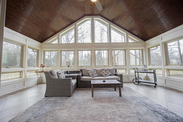 tiled living area with high vaulted ceiling, wood ceiling, a ceiling fan, and a decorative wall