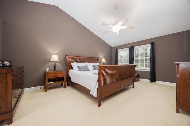 bedroom featuring light carpet, baseboards, lofted ceiling, and a ceiling fan