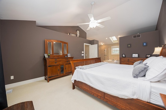 bedroom featuring baseboards, visible vents, vaulted ceiling with skylight, light carpet, and connected bathroom