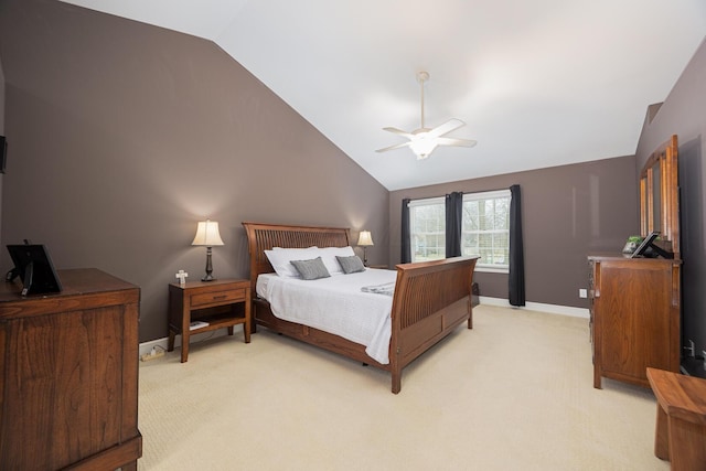 bedroom featuring a ceiling fan, lofted ceiling, light colored carpet, and baseboards