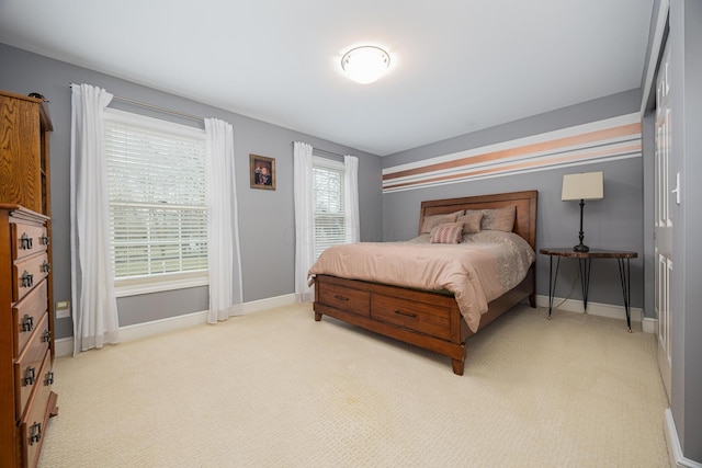 bedroom featuring baseboards and carpet floors