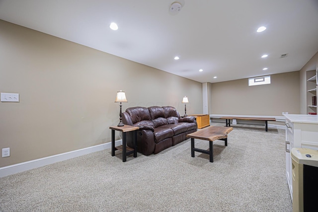 living area featuring recessed lighting, baseboards, and light carpet