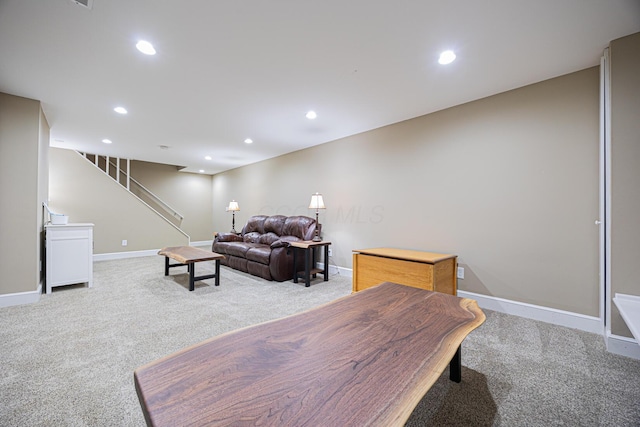 living area with stairs, recessed lighting, baseboards, and light carpet