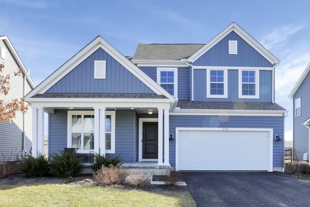 view of front of house with a garage and a porch