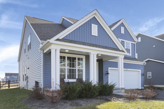 view of front of property with a garage and covered porch