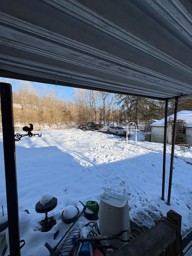 view of yard layered in snow