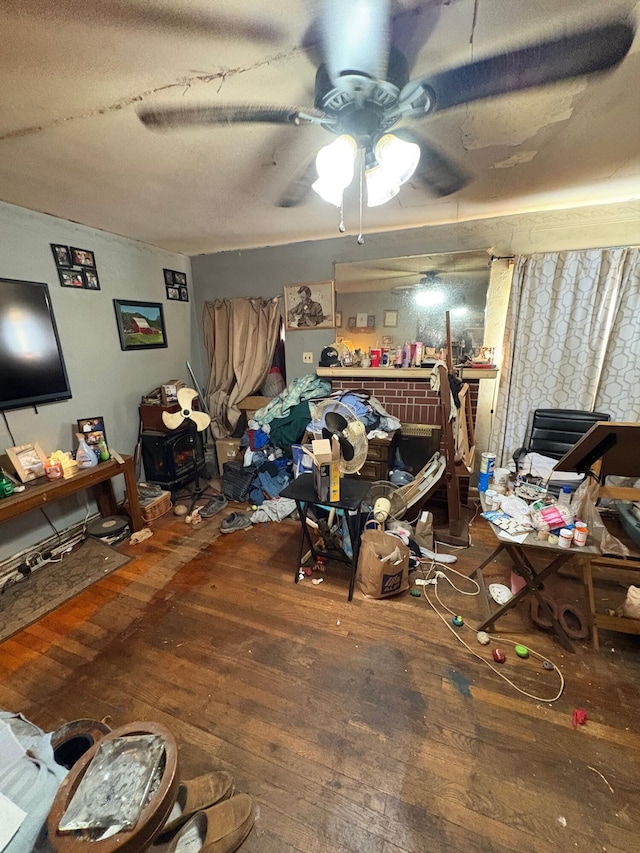 interior space featuring wood-type flooring and ceiling fan