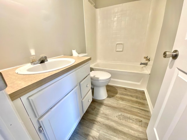 full bathroom with vanity, wood-type flooring, bathtub / shower combination, and toilet