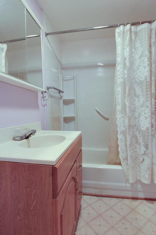 bathroom featuring shower / bath combination with curtain, vanity, and tile patterned floors