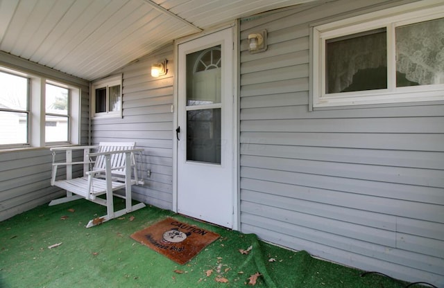 property entrance with covered porch