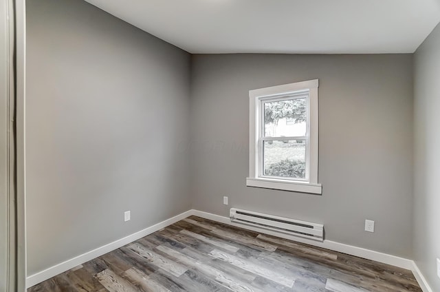 unfurnished room with a baseboard radiator, lofted ceiling, and light hardwood / wood-style floors