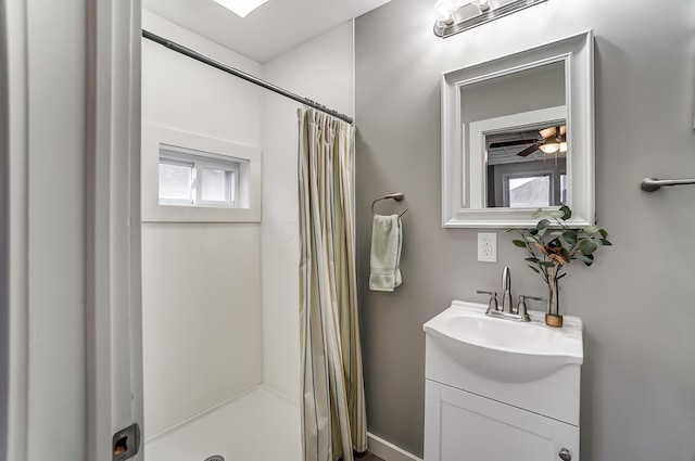 bathroom featuring vanity and a shower with shower curtain