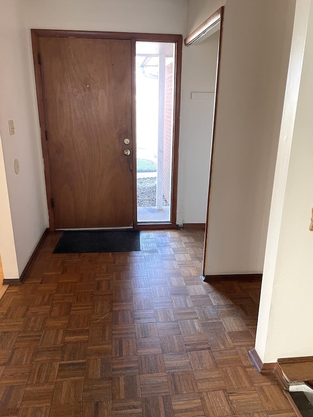 entrance foyer featuring dark parquet floors