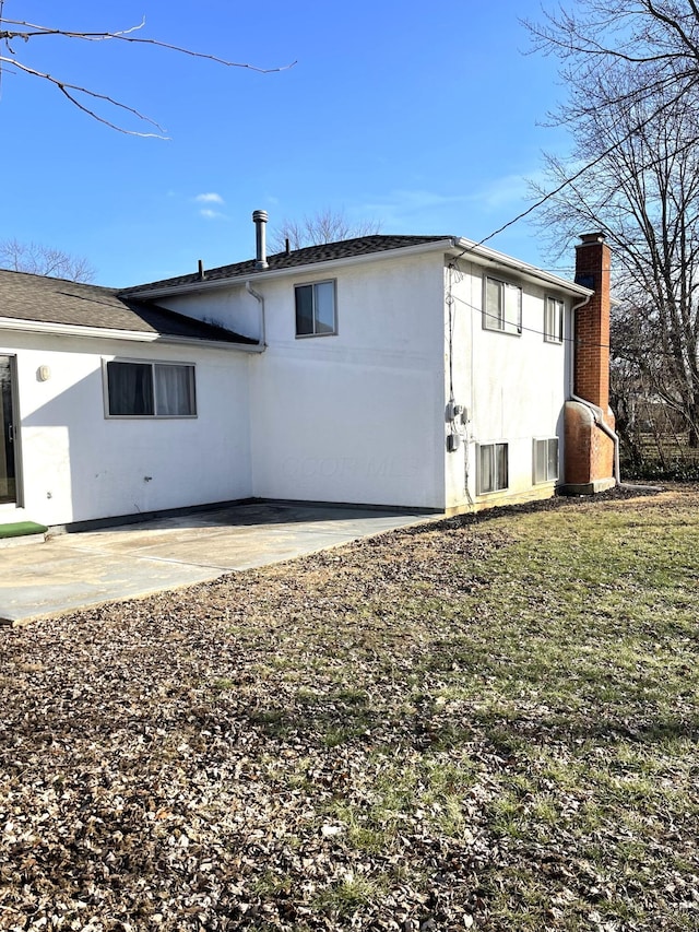 view of property exterior with a patio